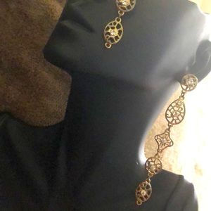 Pierced gold plated earrings with diamonds.